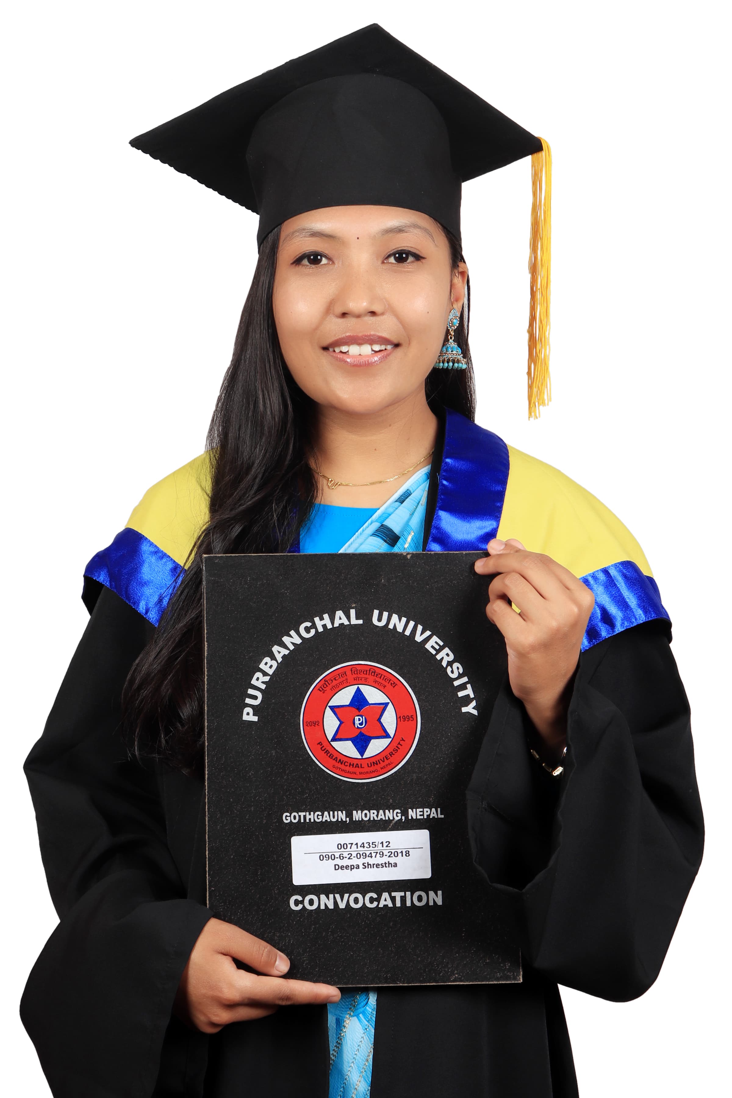 Deepa Shrestha at her nursing convocation, holding her Purbanchal University folder